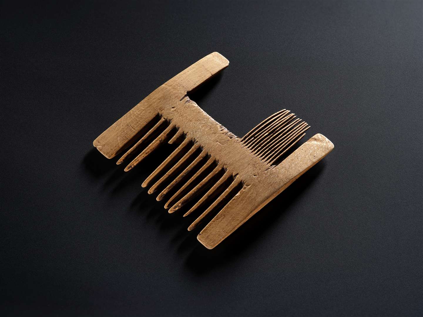 A wooden comb was found with the body (National Museums Scotland/PA)