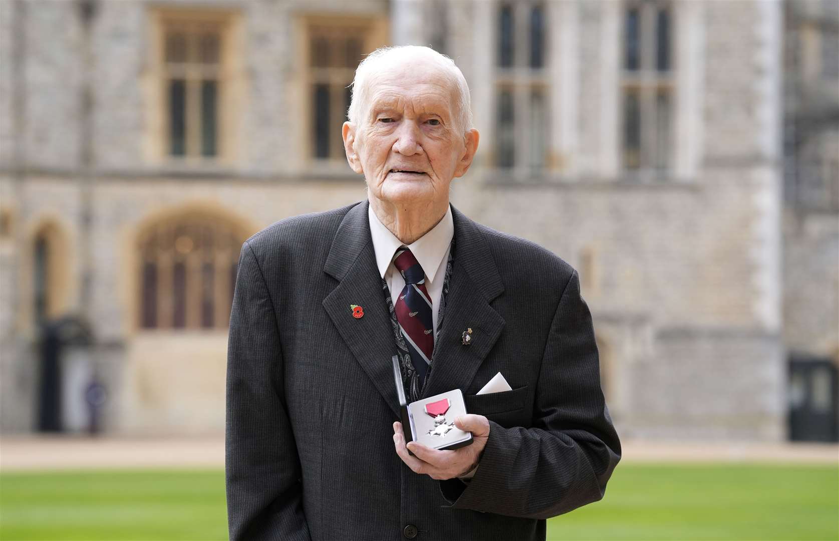 George Kelly after being made an MBE by the King at Windsor Castle (Andrew Matthews/PA)